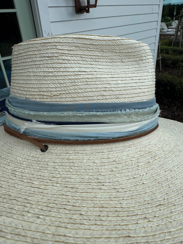 Light hat with stacked blues and creams